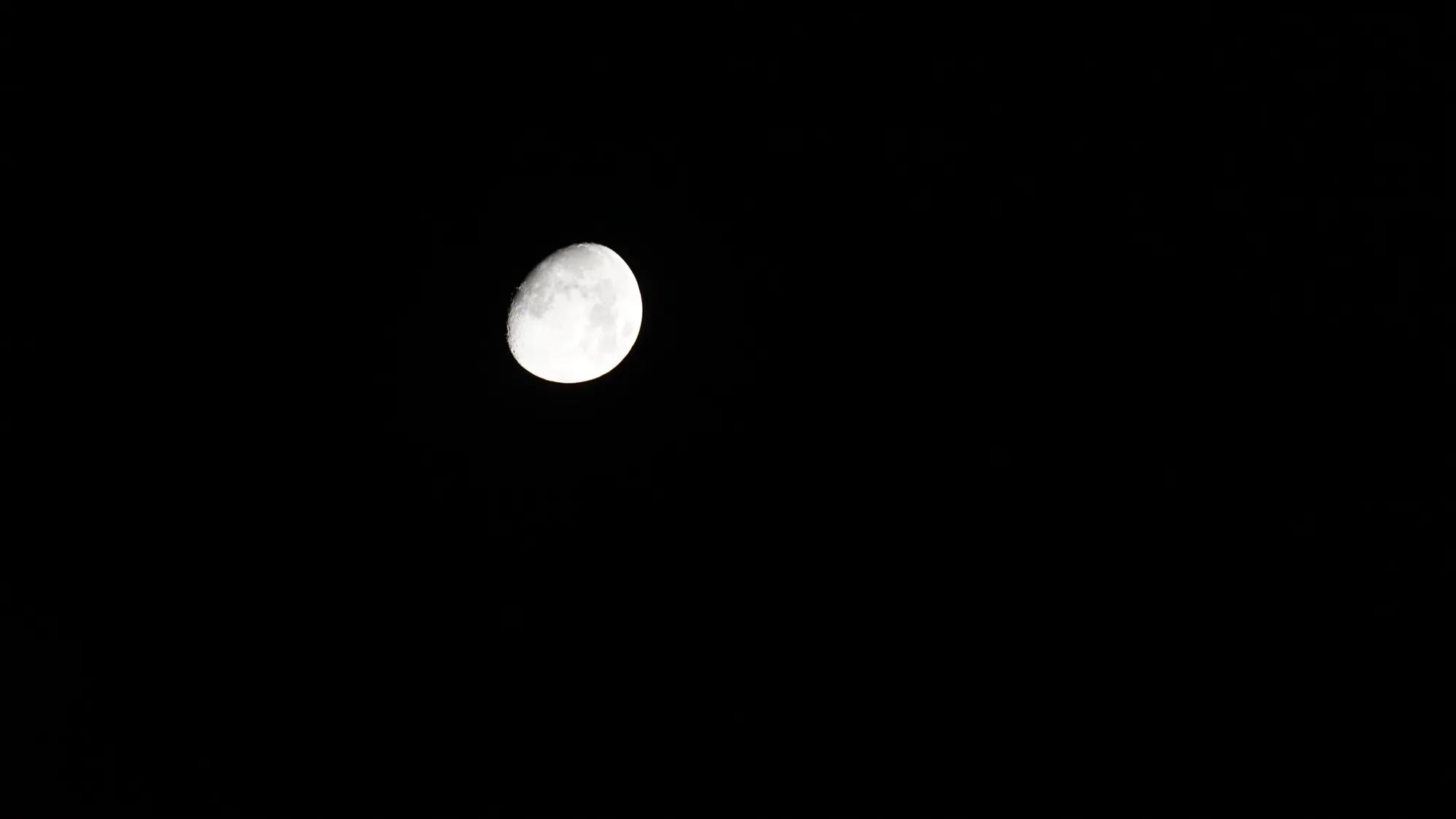 Bright full moon against a black night sky